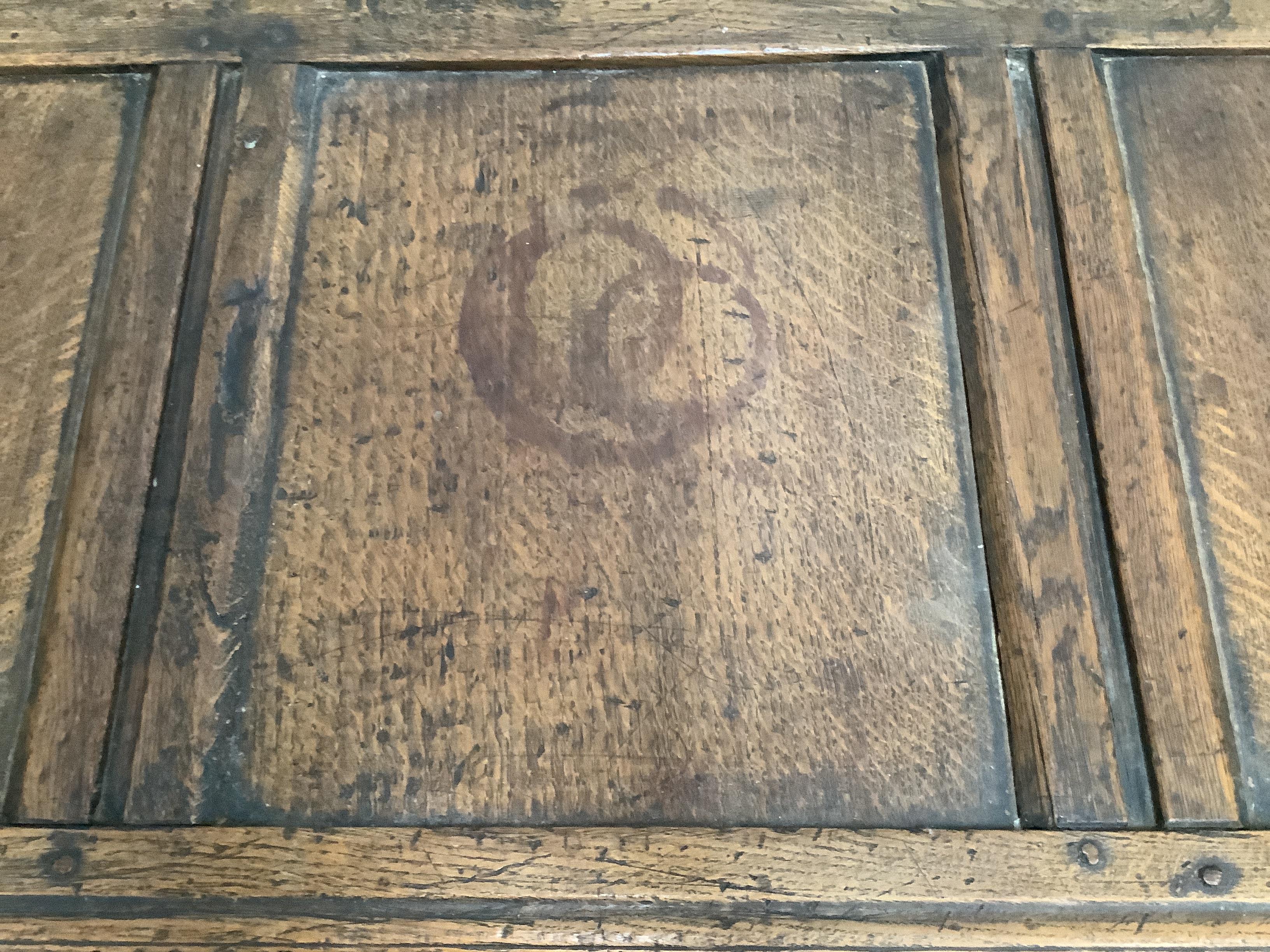 An early 18th century panelled oak coffer, length 121cm, depth 49cm, height 58cm